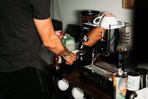 Preparing espresso at a home coffee machine