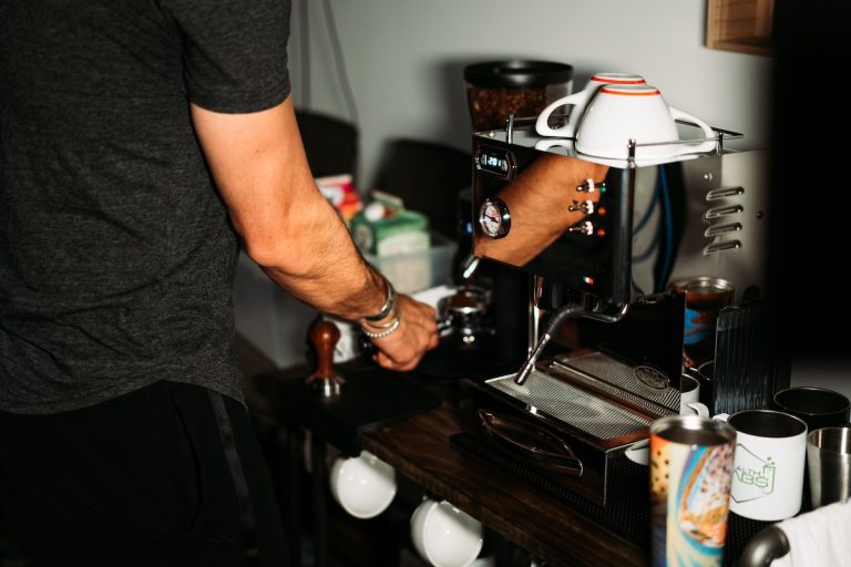 Preparing espresso at a home coffee machine
